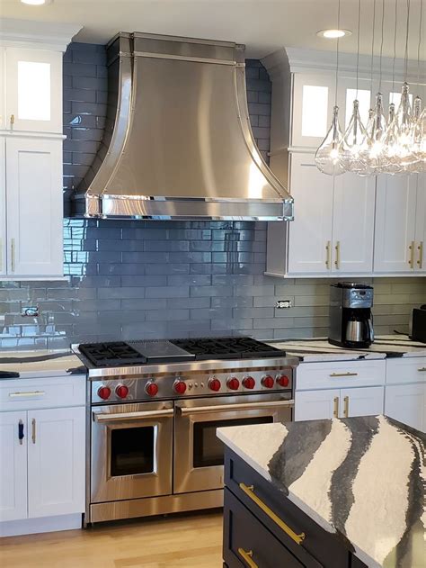 antique white cabinets with stainless steel hood over stve|white stainless steel range hood.